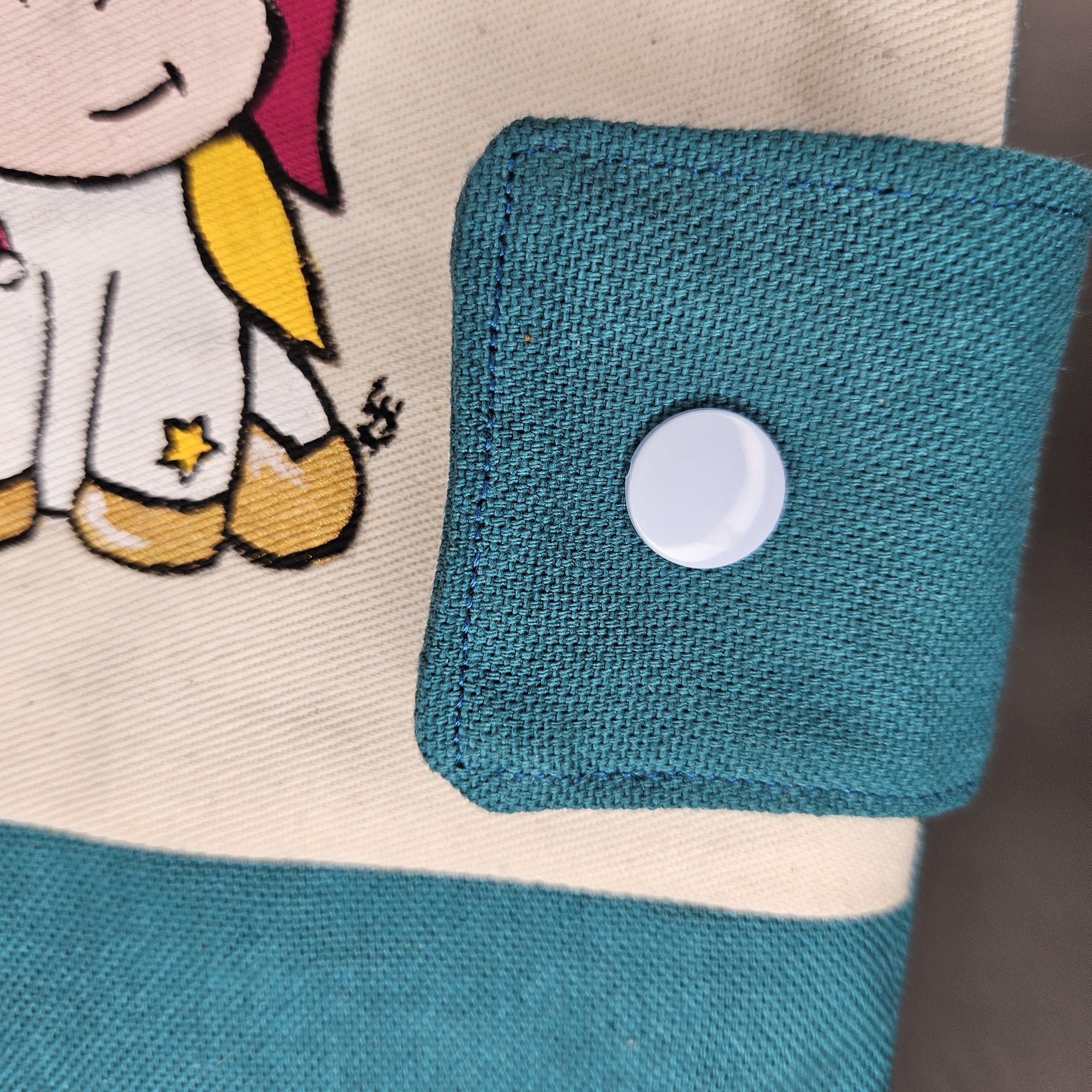 Photo produit carnet de sante licorne bouton de pres